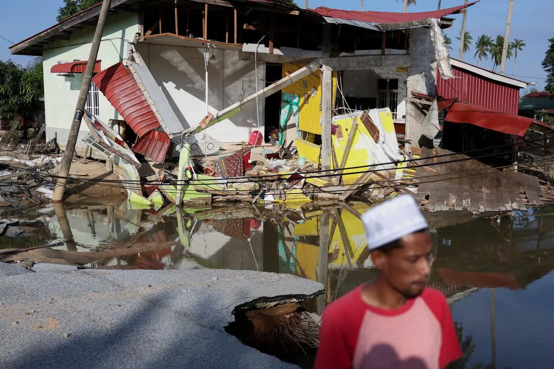A view of a house partially destroyed after floodwaters swept through at Tumpat in Malaysia.