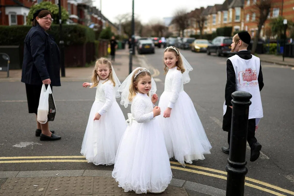 Jewish children dressed in costumes celebrating the annual holiday of Purim in London, Britain, on March 3, 2026. 