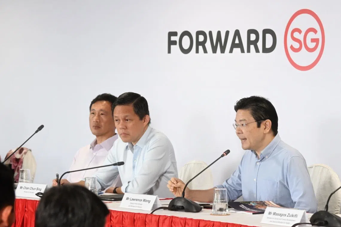 Deputy Prime Minister Lawrence Wong at a press conference in 2023 with (from left) Health Minister Ong Ye Kung and Education Minister Chan Chun Sing.