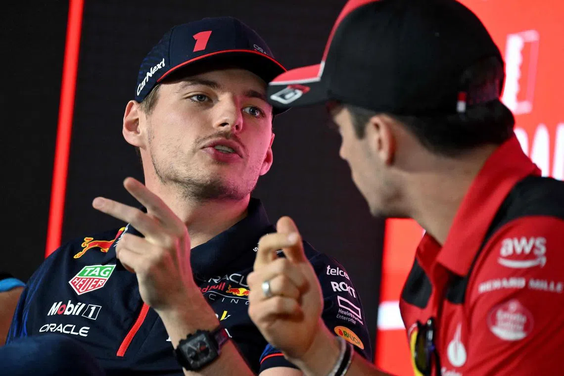 Red Bull's Max Verstappen (left) and  Ferrari's Charles Leclerc attend a press conference ahead of the Bahrain grand prix, on March 2, 2023.