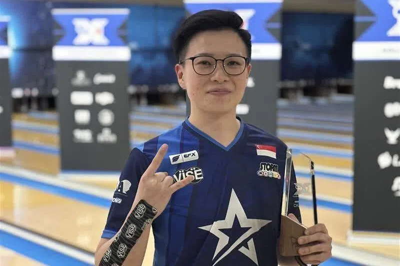 Bowler New Hui Fen flashing a “rock on” hand sign after winning her fourth Professional Women’s Bowling Association title at the Rock ‘n’ Roll Open at Yorktown Lanes in Ohio on June 2, 2025.