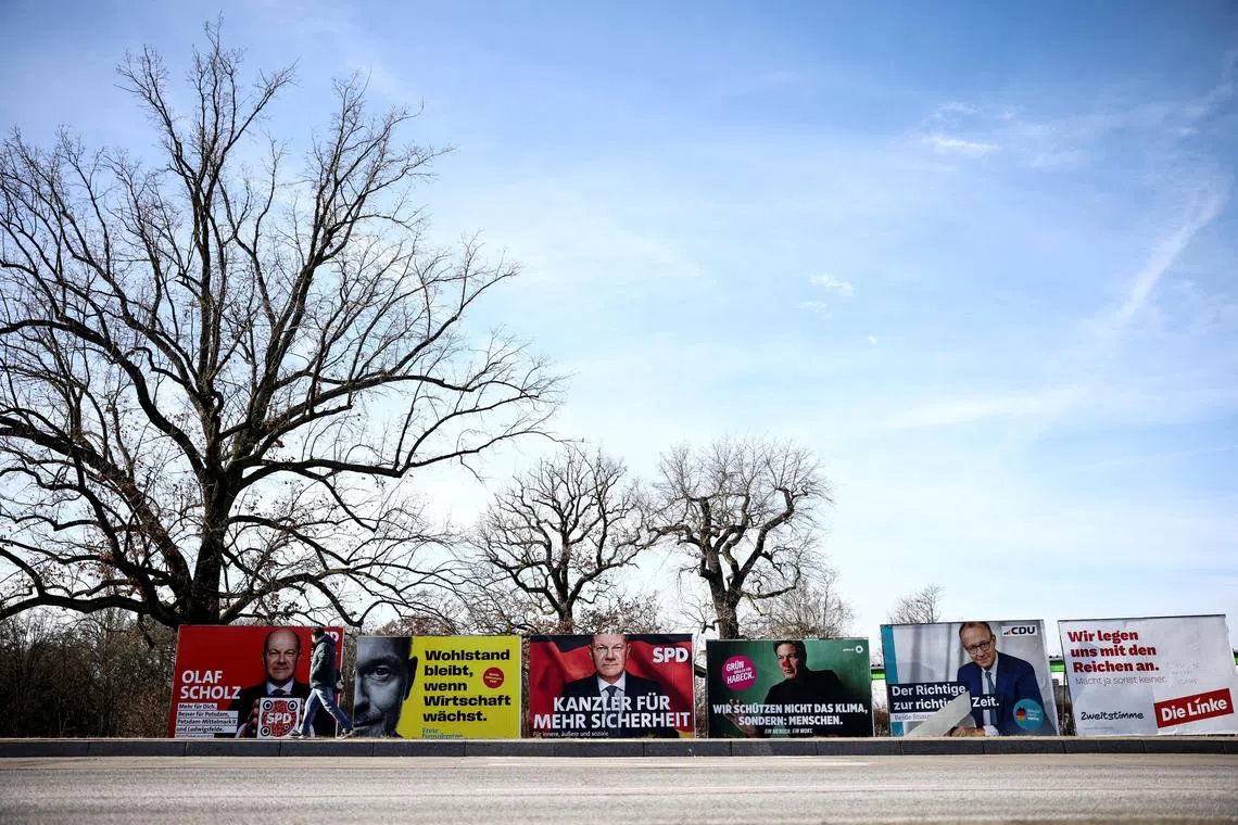 A view shows election campaign billboards of German Chancellor Olaf Scholz of the Social Democratic Party (SPD), Christian Lindner of the Free Democratic Party (FDP), Germany's Greens party candidate Robert Habeck, Friedrich Merz, Christian Democratic Union (CDU) party candidate for chancellor, and of Die Linke party, the day before the parliamentary election in Potsdam, Germany on Feb 22. 