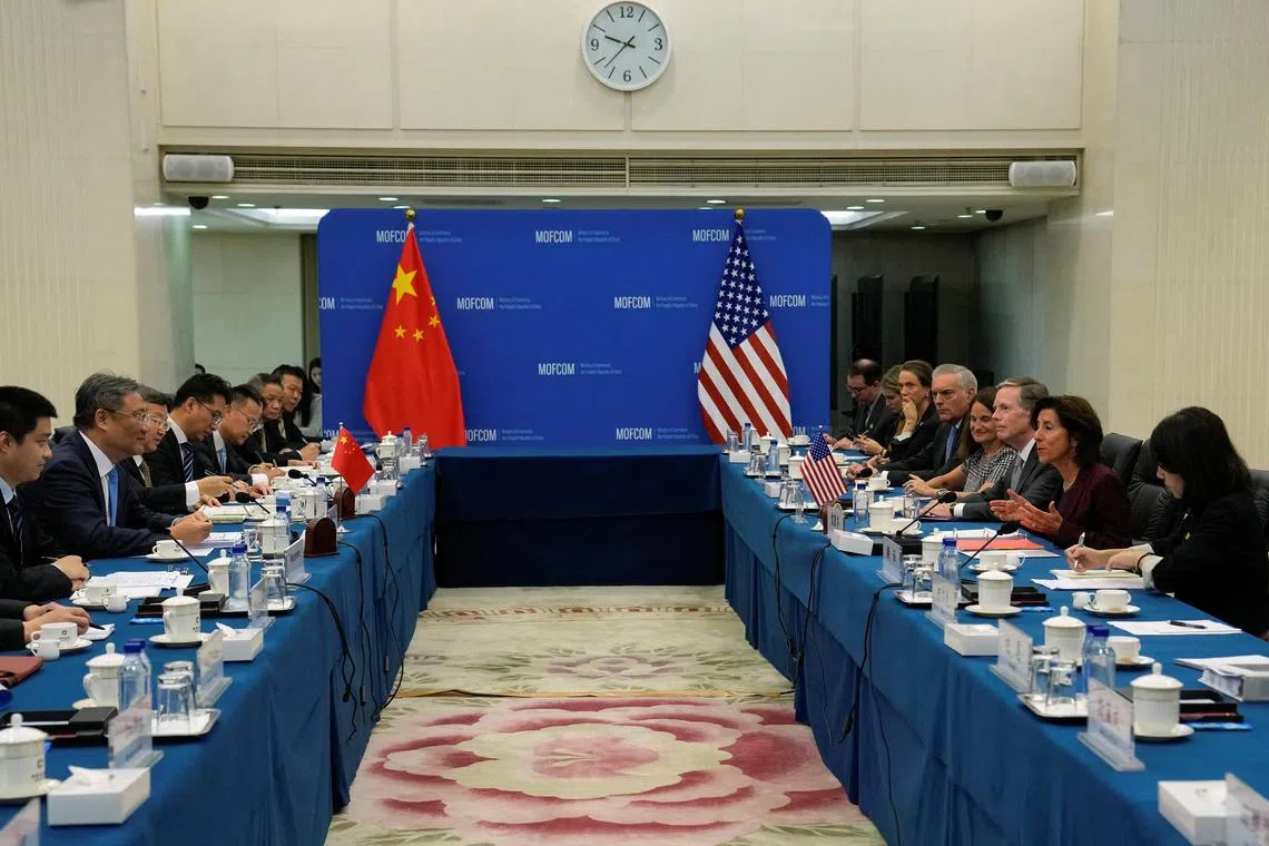 US Commerce Secretary Gina Raimondo (second from right) speaking during a meeting with Chinese Minister of Commerce Wang Wentao (second from left) at the Ministry of Commerce in Beijing on Monday. 