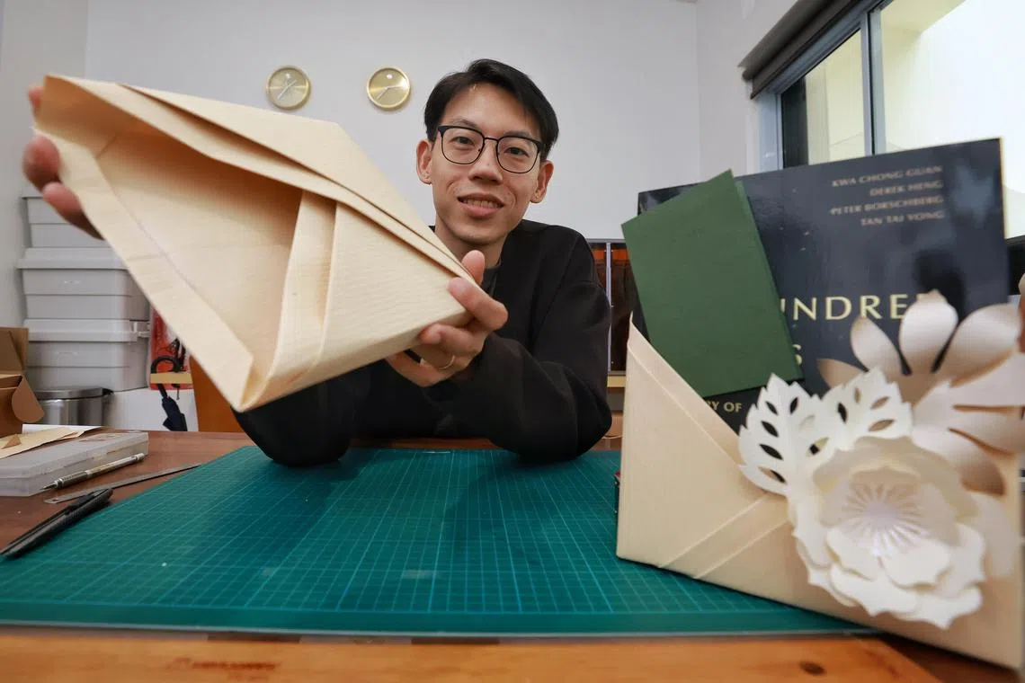 Mr Melvin Ong, 38-year-old product designer and founder of design studio Desinere, with the book sleeve he created using the pleating technique.