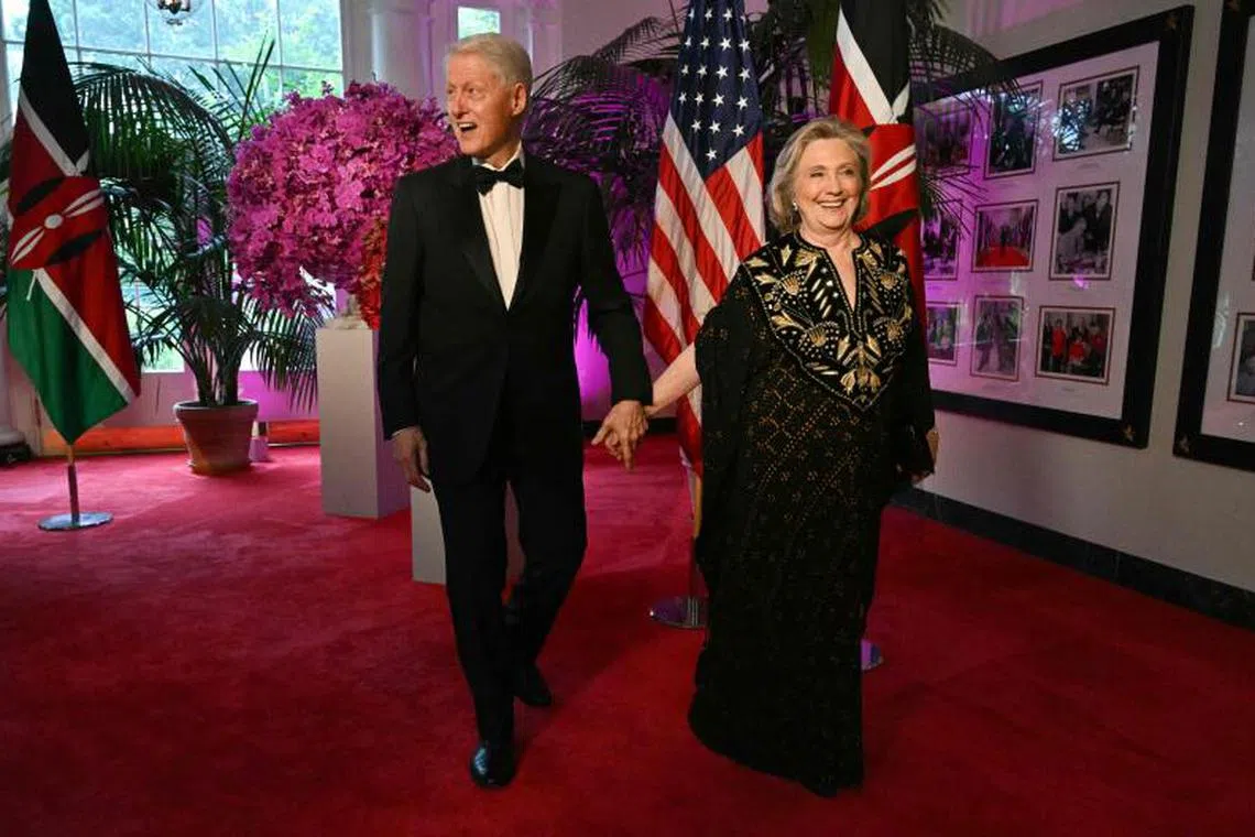 Ex-US president Bill Clinton and his wife Hillary arrive at the White House for a state dinner on May 23, 2024. 