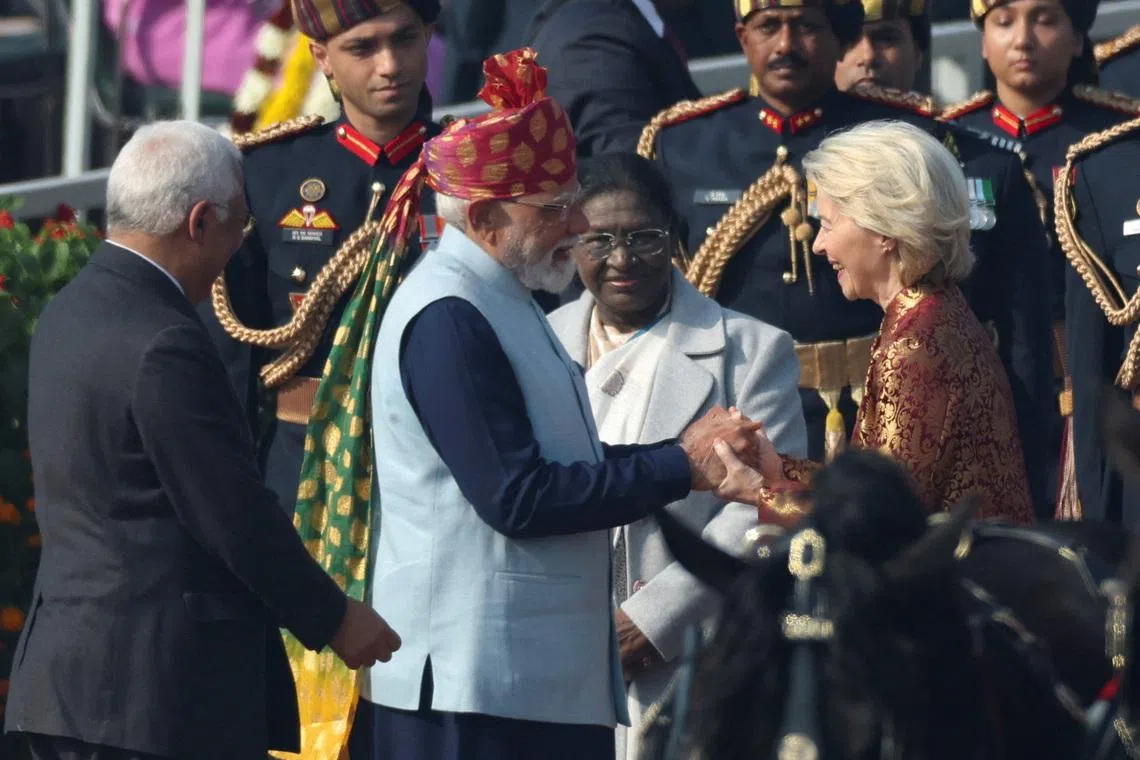India's Prime Minister Narendra Modi greets European Commission President Ursula von der Leyen, next to India's President Droupadi Murmu, as they arrive to attend the Republic Day parade in New Delhi, India.