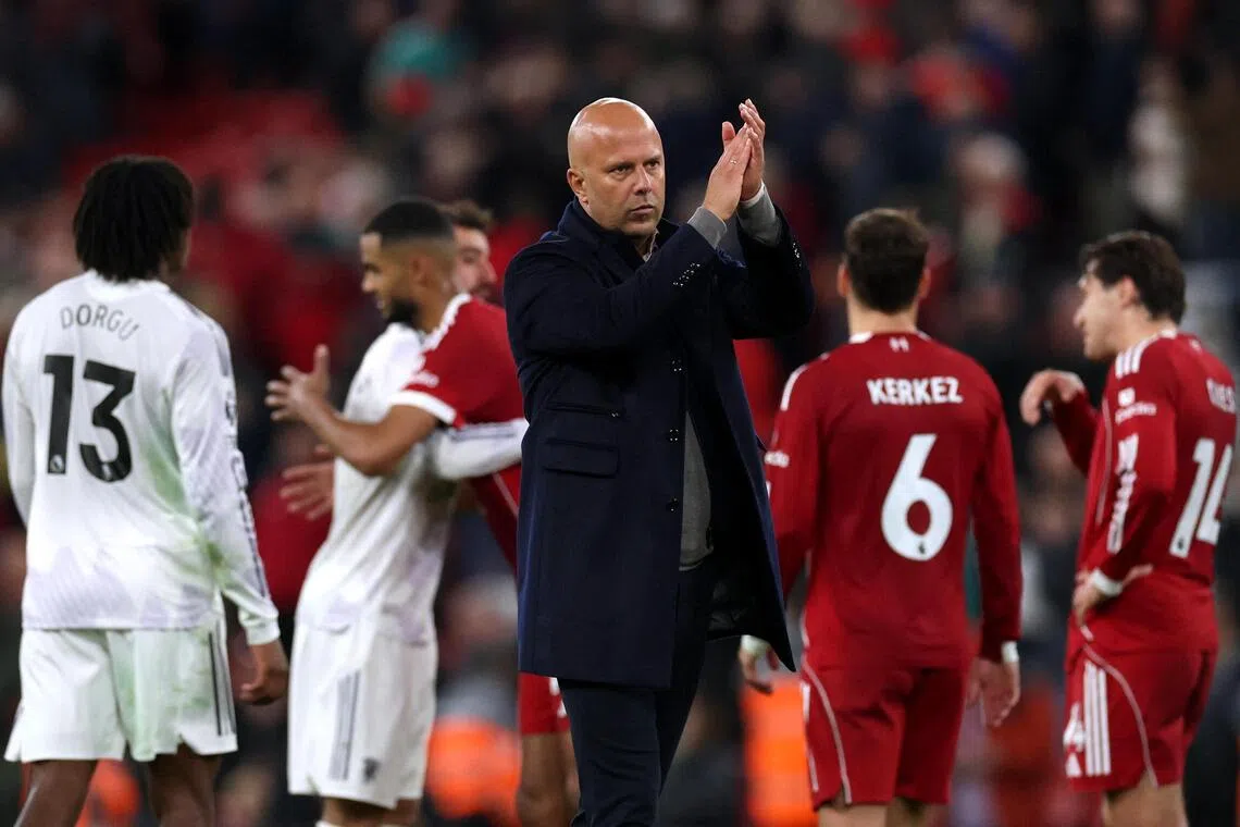 Liverpool manager Arne Slot applauds fans at Anfield after the Premier League loss to Manchester United.