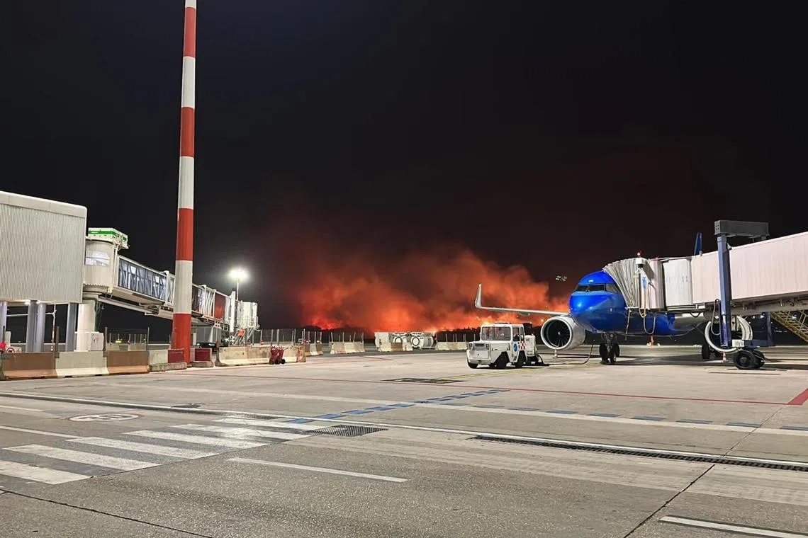 The airport was closed earlier as firefighters sought to put out a major blaze in a nearby area.