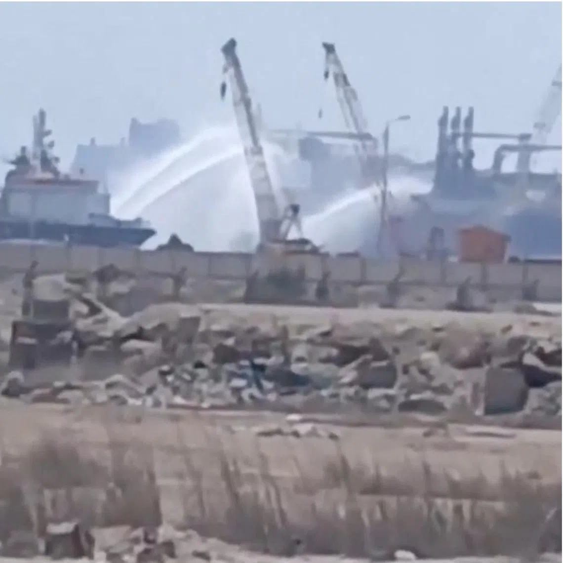Water jets are fired at a US-owned gas tanker, after a reported drone strike at Egypt’s Damietta port on July 29.