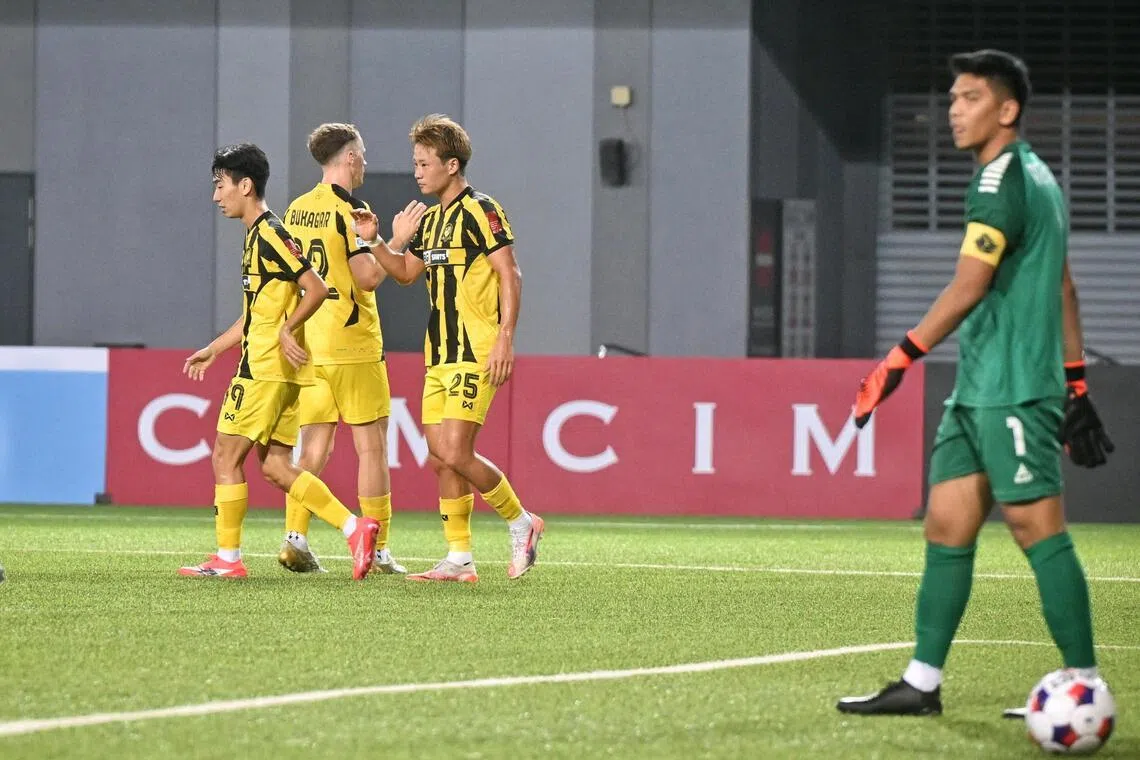 BG Tampines Rovers attacker Hide Higashikawa (No. 25) celebrating with teammates (from left) Joel Chew and Trent Buhagiar after scoring one of his four goals in the 7-1 Singapore Premier League win over Young Lions.