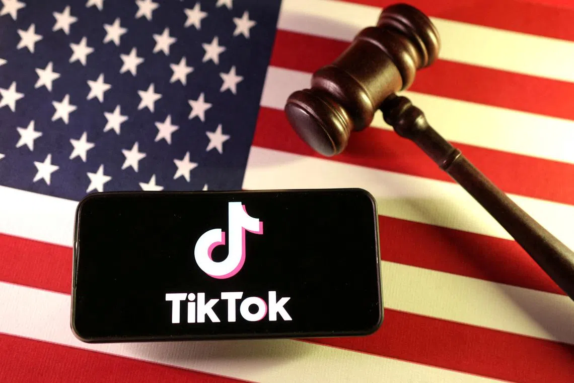 FILE PHOTO: U.S., Chinese flags, TikTok logo and gavel are seen in this illustration taken January 8, 2025. REUTERS/Dado Ruvic/Illustration/File Photo