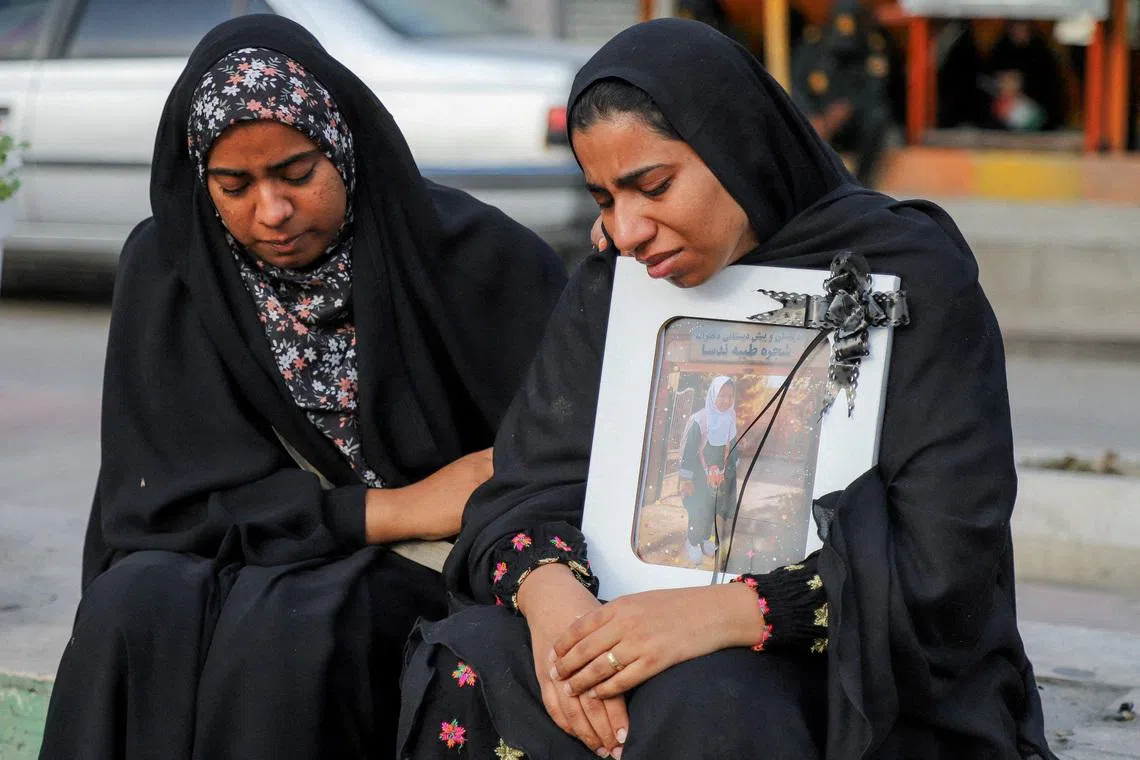 FILE PHOTO: People mourn on the day of the funeral of the victims following a reported strike on a school in Minab, Iran, March 3, 2026. Amirhossein Khorgooei/ISNA/WANA (West Asia News Agency) via REUTERS/File Photo