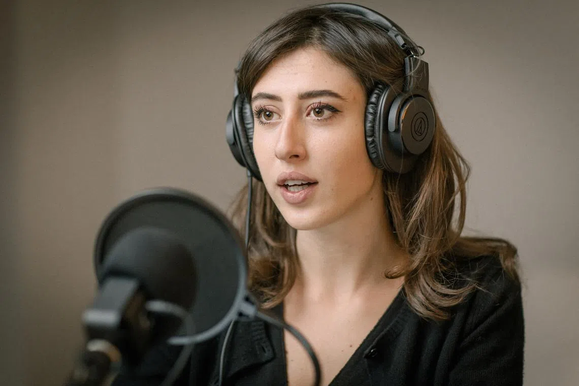 FILE PHOTO: Italian journalist Cecilia Sala, who was arrested by police in Tehran, Iran on December 19, 2024, according to Italy's foreign ministry, records her podcast 'Stories' at her home in Rome, Italy in this undated picture released by Chora Media/via REUTERS/File Photo