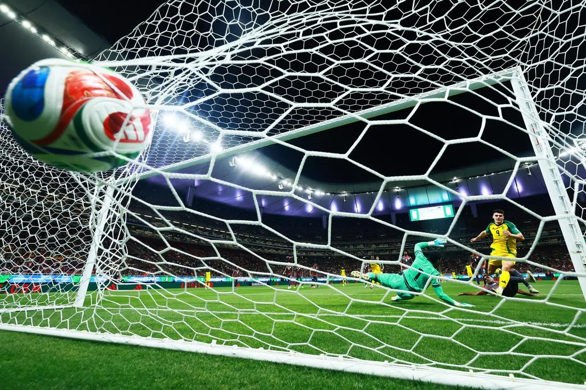 Soccer Football - FIFA World Cup - Inter-Confederation Playoffs - Semi Final - New Caledonia v Jamaica - Estadio Guadalajara, Guadalajara, Mexico - March 26, 2026 Jamaica's Bailey-Tye Cadamarteri scores their first goal REUTERS/Eloisa Sanchez