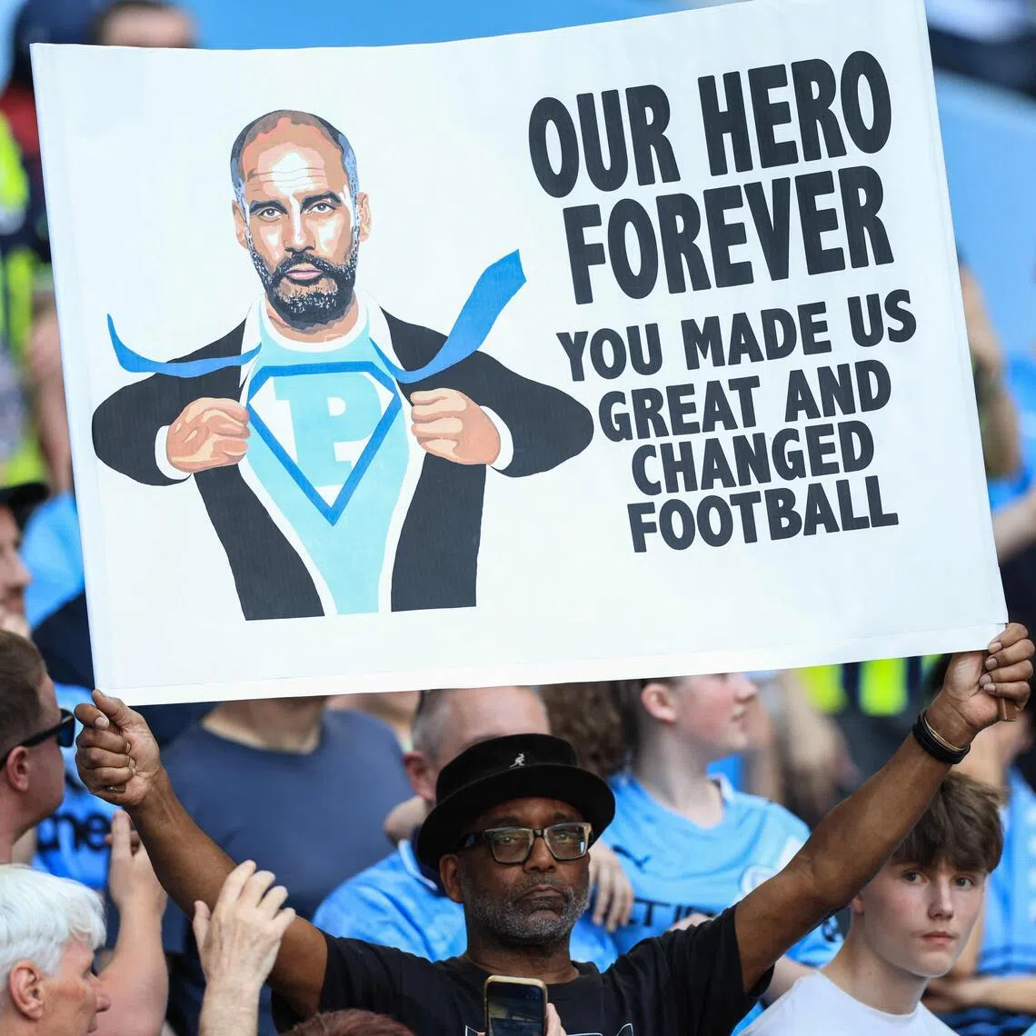 A supporter holds up a sign in honour of Manchester City's Spanish manager Pep Guardiola during ceremonies to honour those leaving the club, including Guardiola, at the end of the season. 