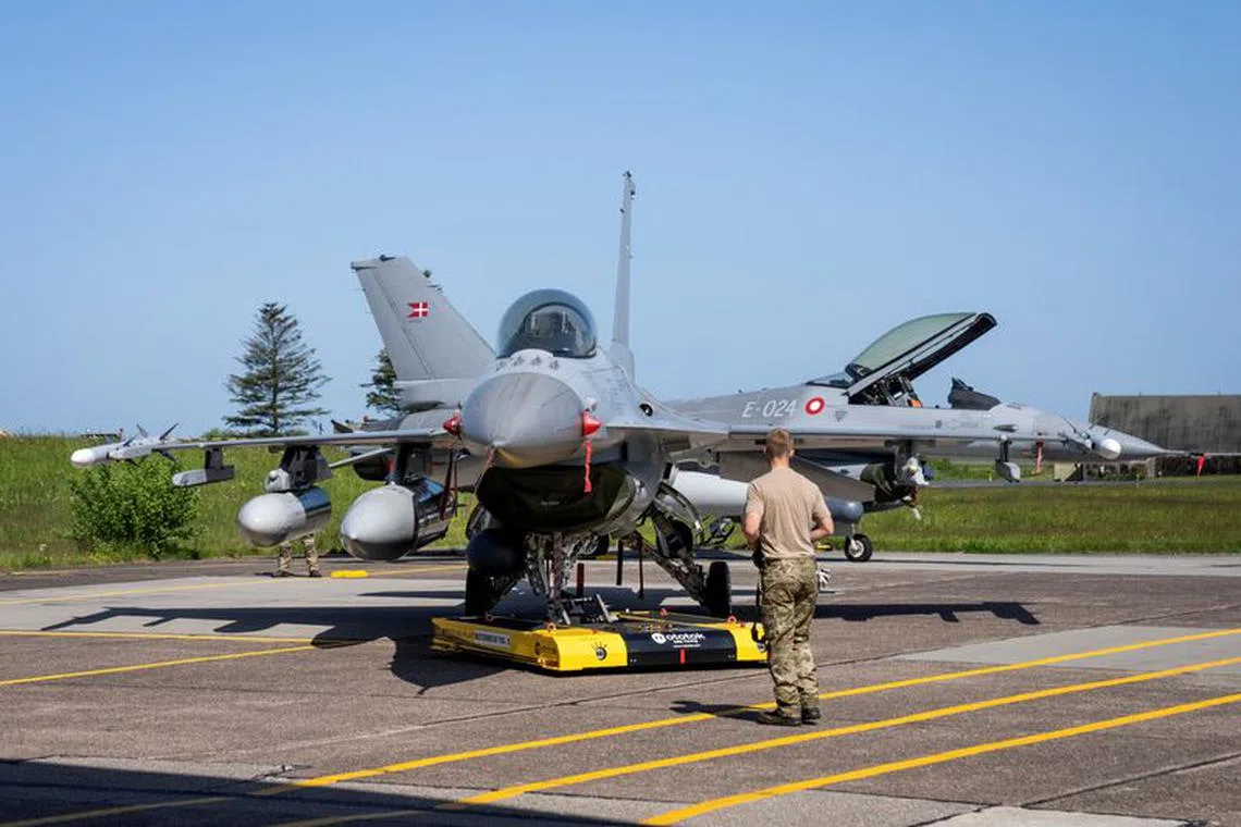 Danish F-16 fighter jets are seen at Fighter Wing Skrydstrup near Vojens, Denmark May 25, 2023. Ritzau Scanpix/Bo Amstrup via REUTERS/ File Photo