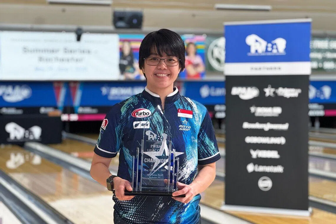 National bowler Cherie Tan posing with her PWBA Lilac City Open title on June 1 after securing her first win in two years.