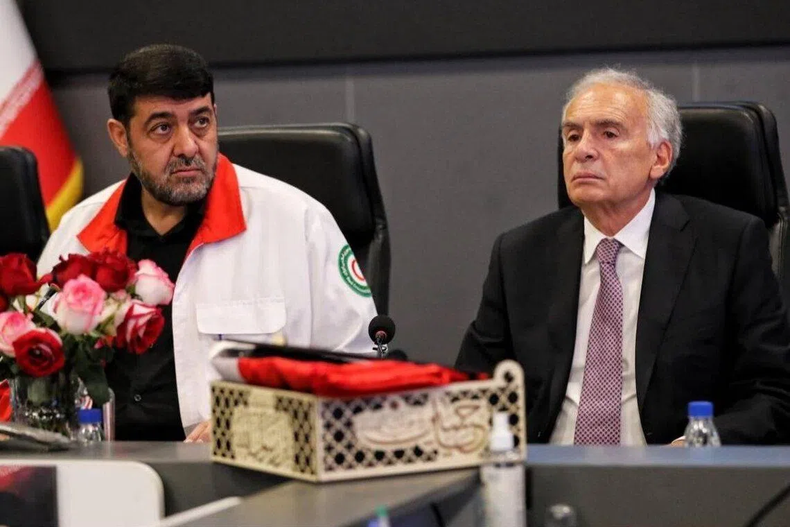 Red Crescent Society president Pirhossein Kolivand (left) and UN envoy Jean Arnault in a photo posted on social media by the Iranian Red Crescent Society.