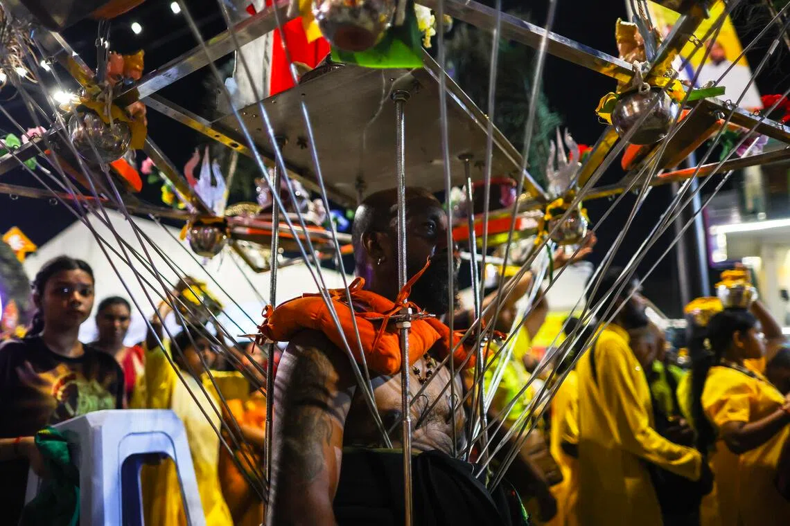 A Hindu devotee carries the 'Kavadi' during a procession at the Thaipusam Festival, in Kuala Lumpur.