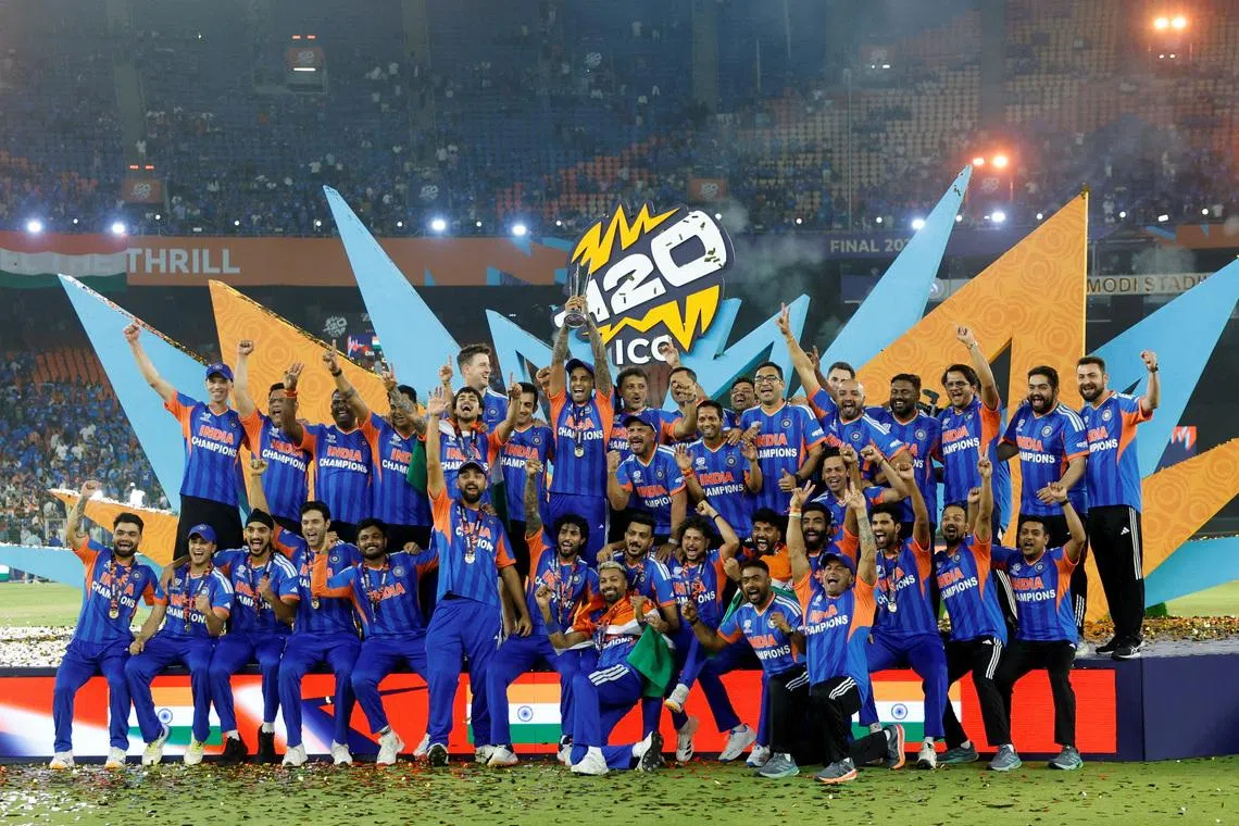 Cricket - ICC Men's T20 World Cup 2026 - Final - India v New Zealand - Narendra Modi Stadium, Ahmedabad, India - March 8, 2026 India's Suryakumar Yadav lifts the trophy as he celebrates with teammates after winning the ICC Men's T20 World Cup REUTERS/Amit Dave