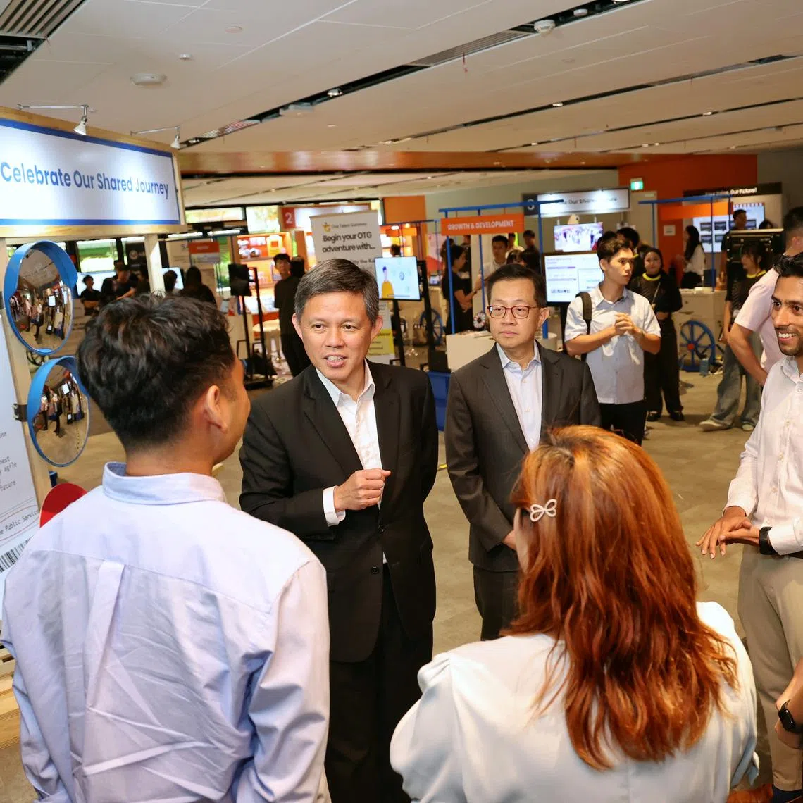 Coordinating Minister for Public Services Chan Chun Sing speaks with award recipients at the Public Service Festival 2025 and Public Sector Transformation Awards Ceremony at One Punggol on July 8.
