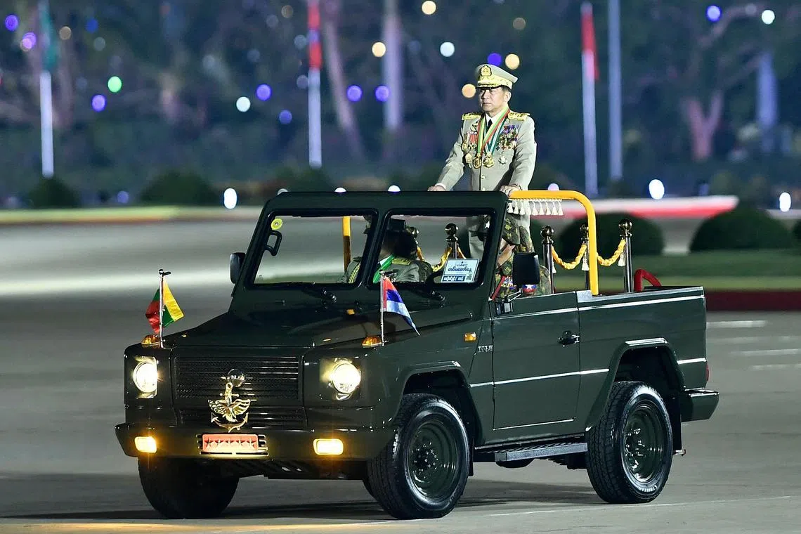 (FILES) Myanmar's junta chief military Min Aung Hlaing arrives to deliver a speech during a ceremony to mark the country's Armed Forces Day in Naypyidaw on March 27, 2024. Myanmar's embattled junta chief arrived in China on November 5, 2024 -- his first reported visit since leading a coup in 2021 -- but analysts say the invitation is only a lukewarm endorsement from his key ally and could backfire. (Photo by AFP)
