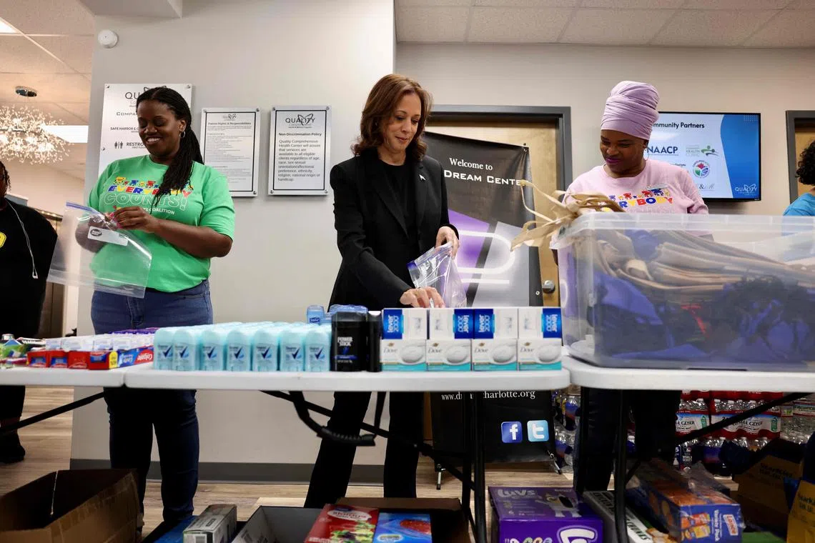 US Vice-President Kamala Harris helping to prepare hygiene-related care packages at a health clinic where the North Carolina Counts Coalition non-profit is preparing for victims of Hurrricane Helene in Charlotte, North Carolina, on Oct 5. 