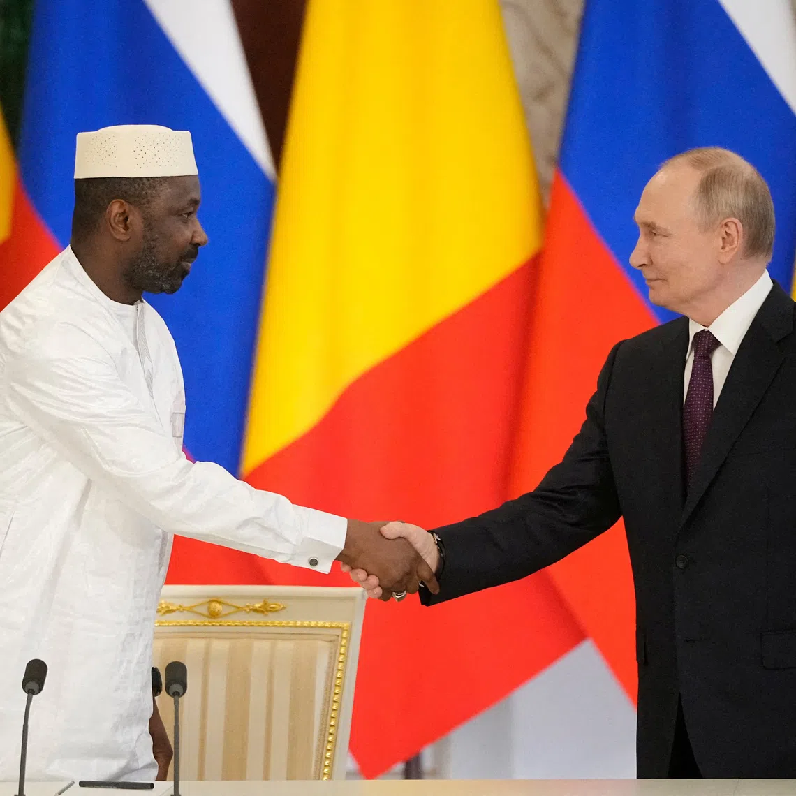 FILE PHOTO: Russian President Vladimir Putin shakes hands with Interim President of the Republic of Mali Assimi Goita during a signing ceremony following their talks at the Grand Kremlin Palace in Moscow, Russia June 23, 2025. Pavel Bednyakov/Pool via REUTERS/File Photo