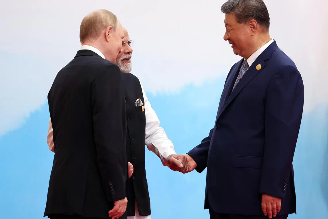 (From left) Russian President Vladimir Putin, Indian Prime Minister Narendra Modi and Chinese President Xi Jinping at the Shanghai Cooperation Organisation summit in Tianjin on Sept 1.