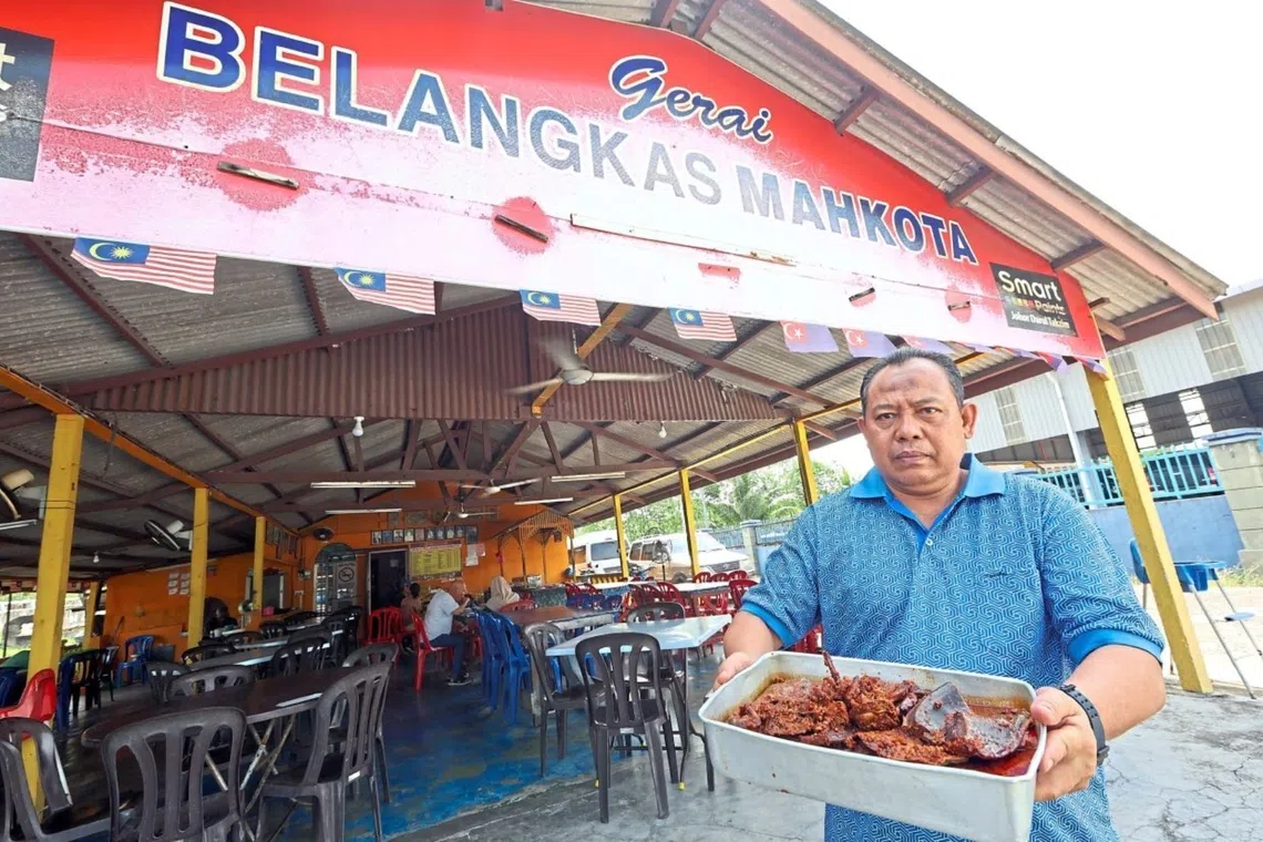 Mr Mohd Khair with the sambal horseshoe crab at his restaurant in Kota Tinggi.