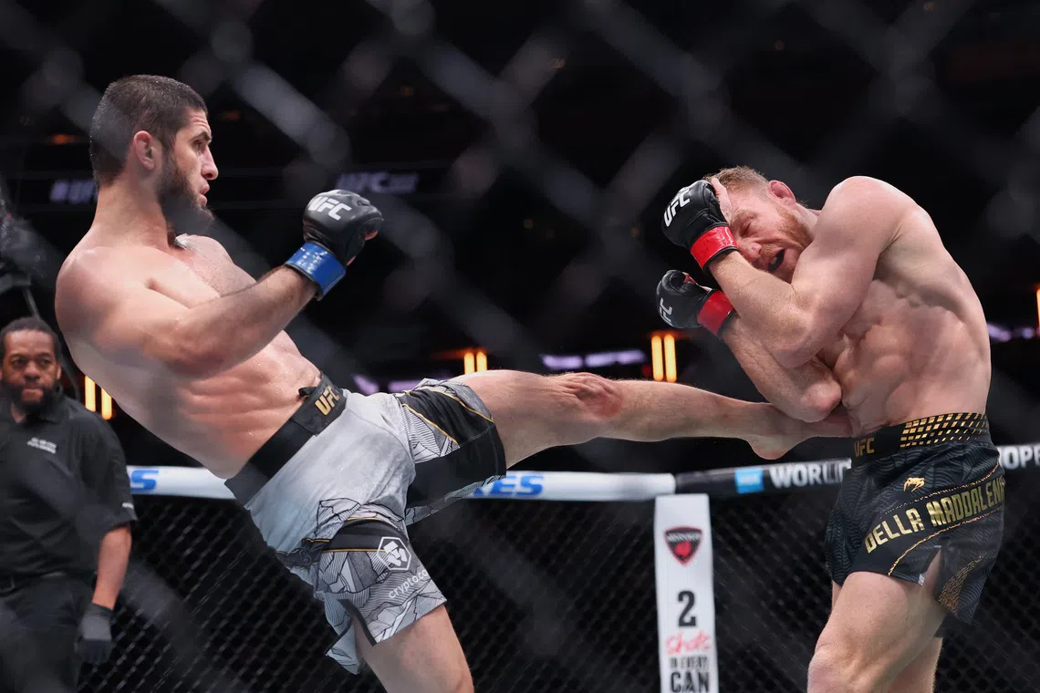Islam Makhachev (left) fighting Jack Della Maddalena in the welterweight championship bout during UFC 322 on Nov 15.