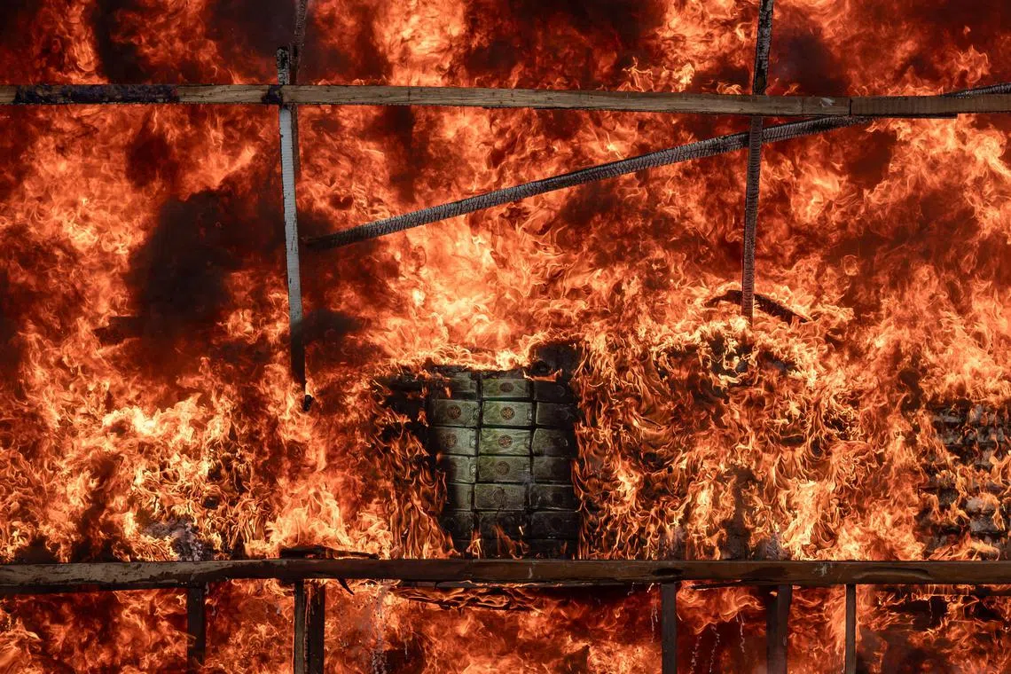 A burning pile of seized illegal drugs during a destruction ceremony to mark the "International Day against Drug Abuse and Illicit Trafficking" in Yangon, on June 26, 2025. 