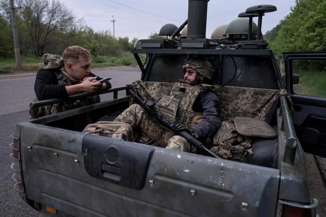 Ukrainian servicemen outside the front-line city of Kostiantynivka, in Ukraine's Donetsk region, in May 2025.