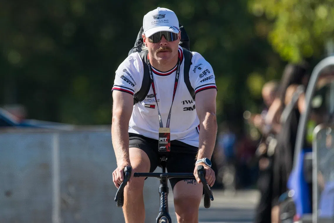Cadillac’s Valtteri Bottas arrives in the paddock with a bicycle ahead of the Italian Formula One Grand Prix at the Autodromo Nazionale Monza circuit in Monza, Italy on Sept 4, 2026.