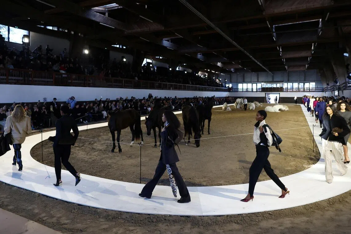 Models present creations by designer Stella McCartney as part of her Fall/Winter 2026/2027 Women's ready-to-wear collection show during Paris Fashion Week in Paris, March 4, 2026. 