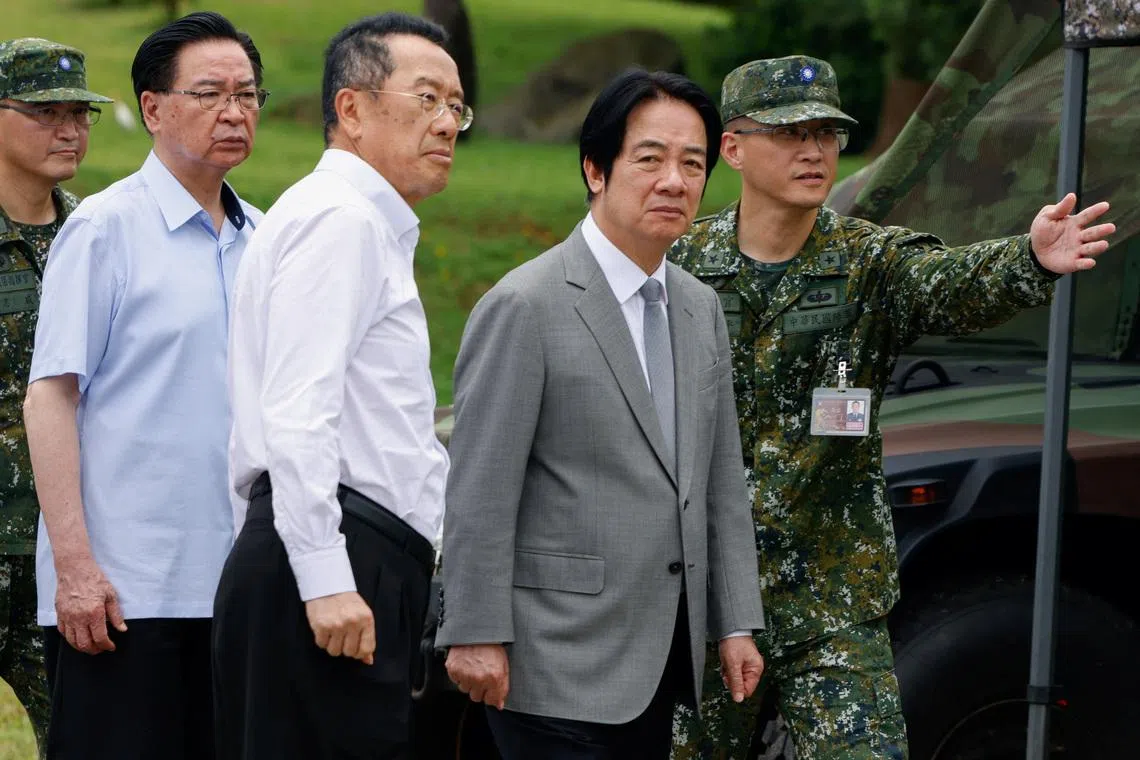 Taiwan president says he 'won't give up' on defence spending after parliament cuts