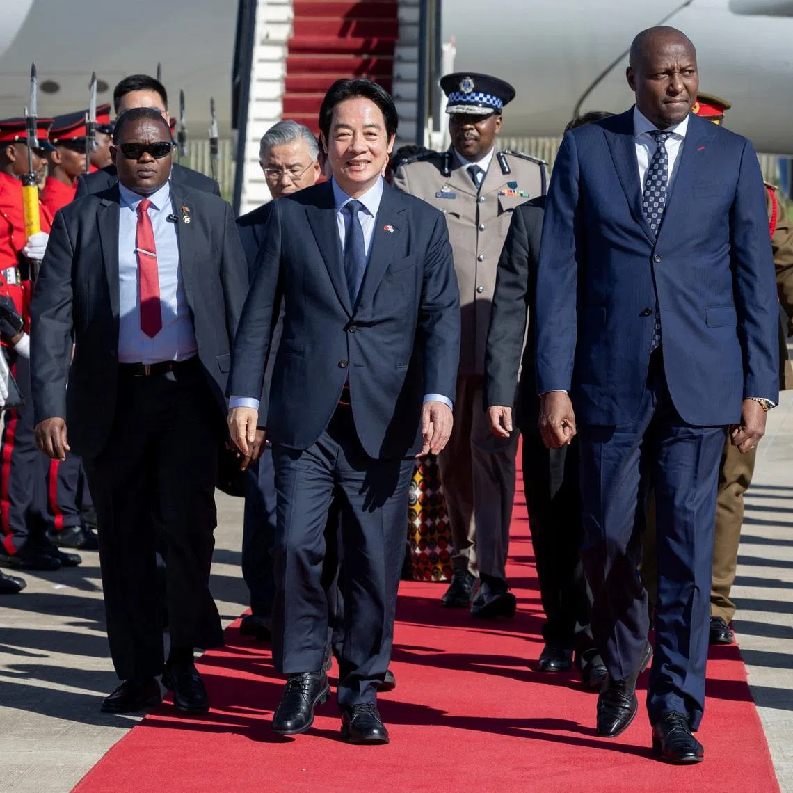 Taiwan President Lai Ching-te walks with Eswatini Prime Minister Russell Mmiso Dlamini upon arriving in Eswatini on May 2.