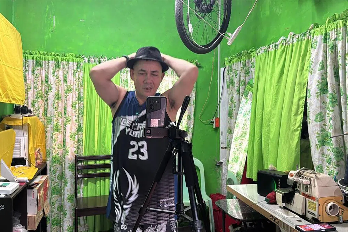 Filipino content creator Efren Palines, known as Tatay Peng, performs his signature "Ice cream yummy" dance move during a live stream on Tiktok on December 4, 2024.
