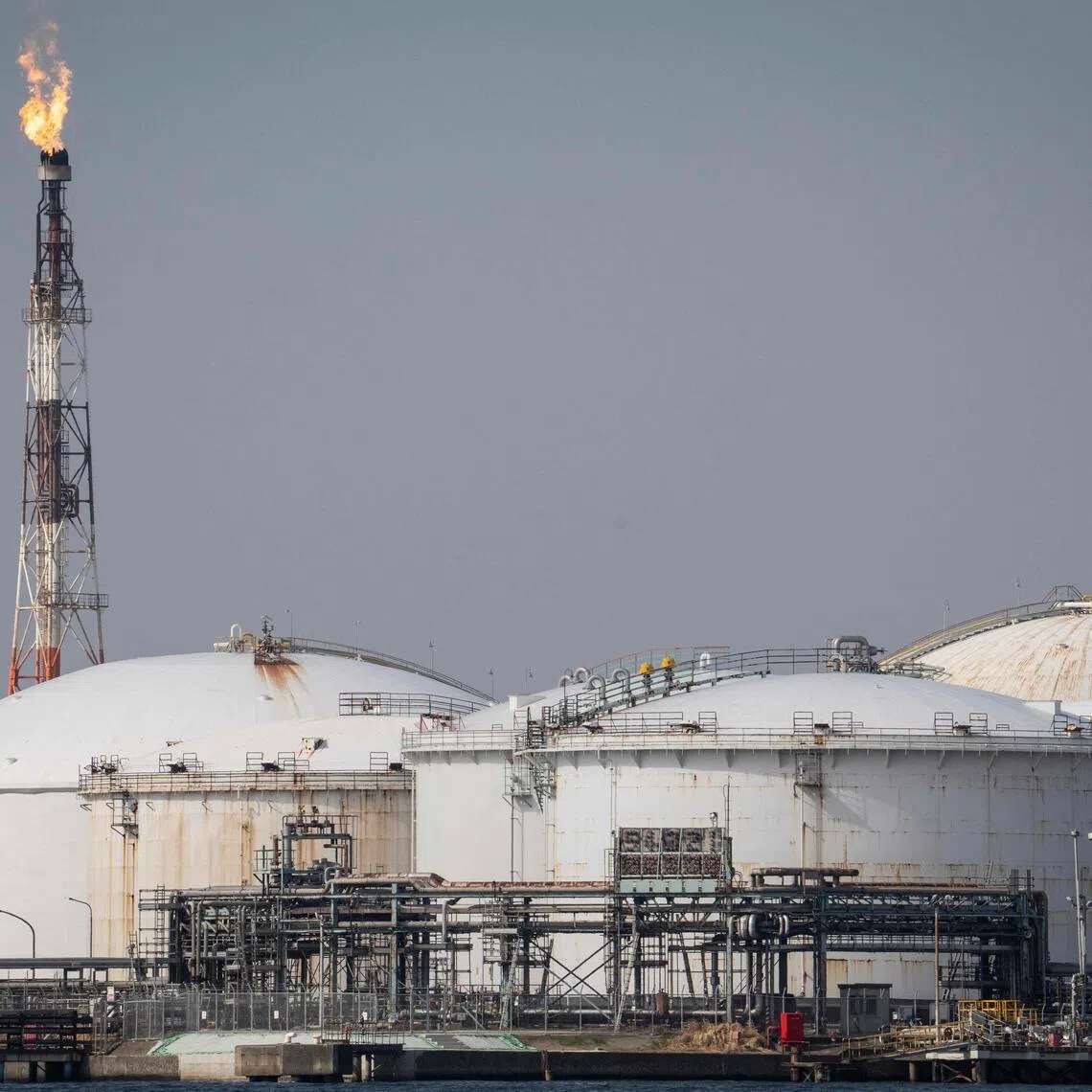 Storage tanks are seen at an oil refinery in Kawasaki, Kanagawa prefecture on March 17.