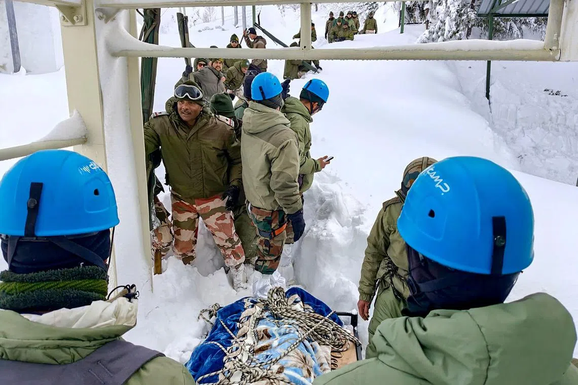 In this handout photograph taken on March 1, 2025 and released by the Department of Information and Public Relations (DIPR) Uttarakhand, security personnel conduct a rescue operation  a day after an avalanche hit a Border Roads Organisation (BRO) construction camp. 