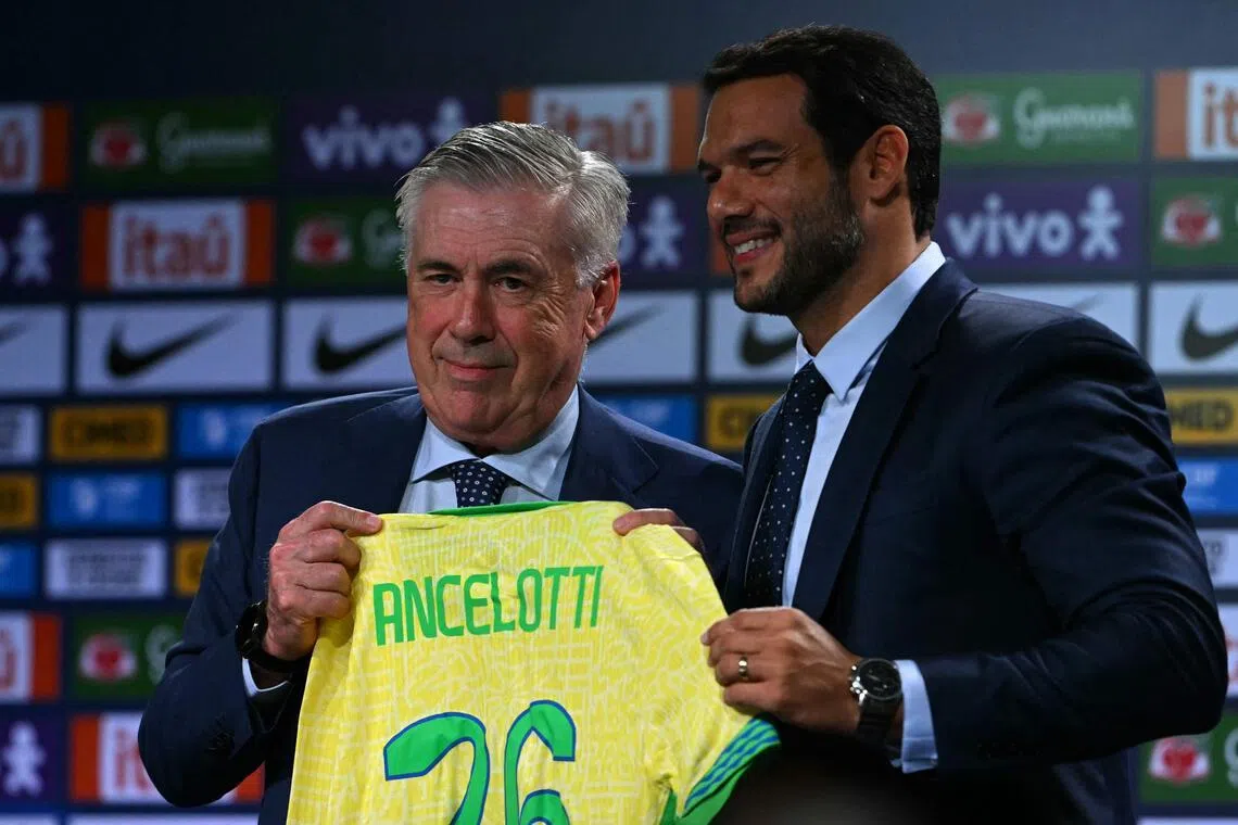Carlo Ancelotti receives the team's jersey from the president of the Brazilian Football Confederation (CBF) Samir Xaud during his official presentation at a hotel in Barra da Tijuca neighbourhood, Rio de Janeiro, Brazil, on May 26, 2025.