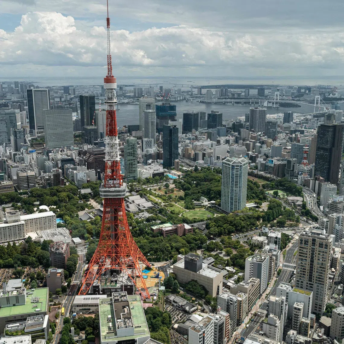 Tokyo Tower is seen from the 52nd floor of "Azabudai Hills", the latest project by Japanese property developer Mori Building Co., in central Tokyo on August 8, 2023. (Photo by Richard A. Brooks / AFP)