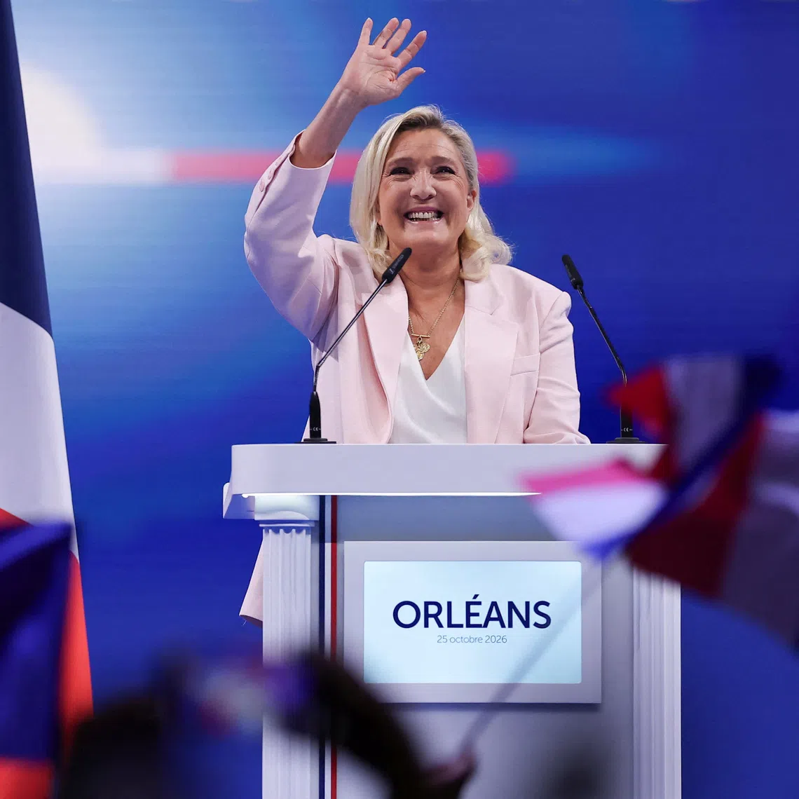 French far-right leader Marine Le Pen delivers a speech during a political rally to launch her presidential campaign, after the party’s congress on Oct 25 in Orleans, France.