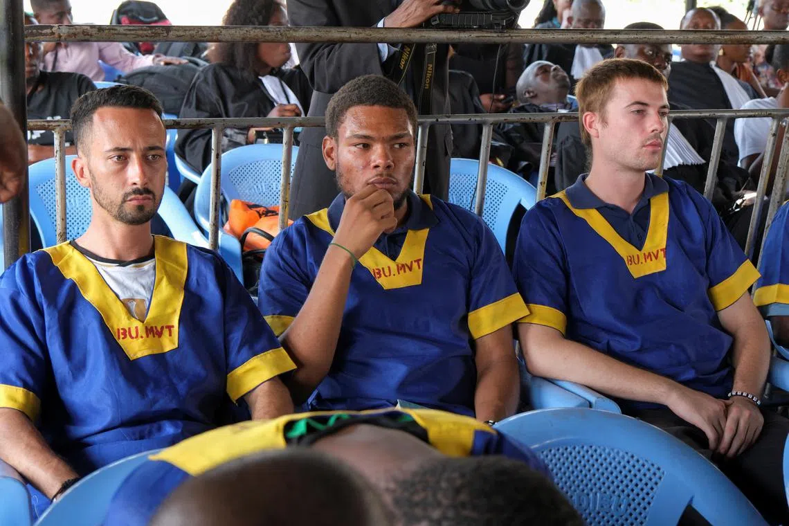 Benjamin Zalman Polun, Marcel Malanga and Taylor Thompson, American citizens suspected along with a group of around fifty other people to be involved in an attempted coup in Congo, wait for the final verdict during their trial in Kinshasa, Democratic Republic of Congo, September 13, 2024. REUTERS/Justin Makangara

