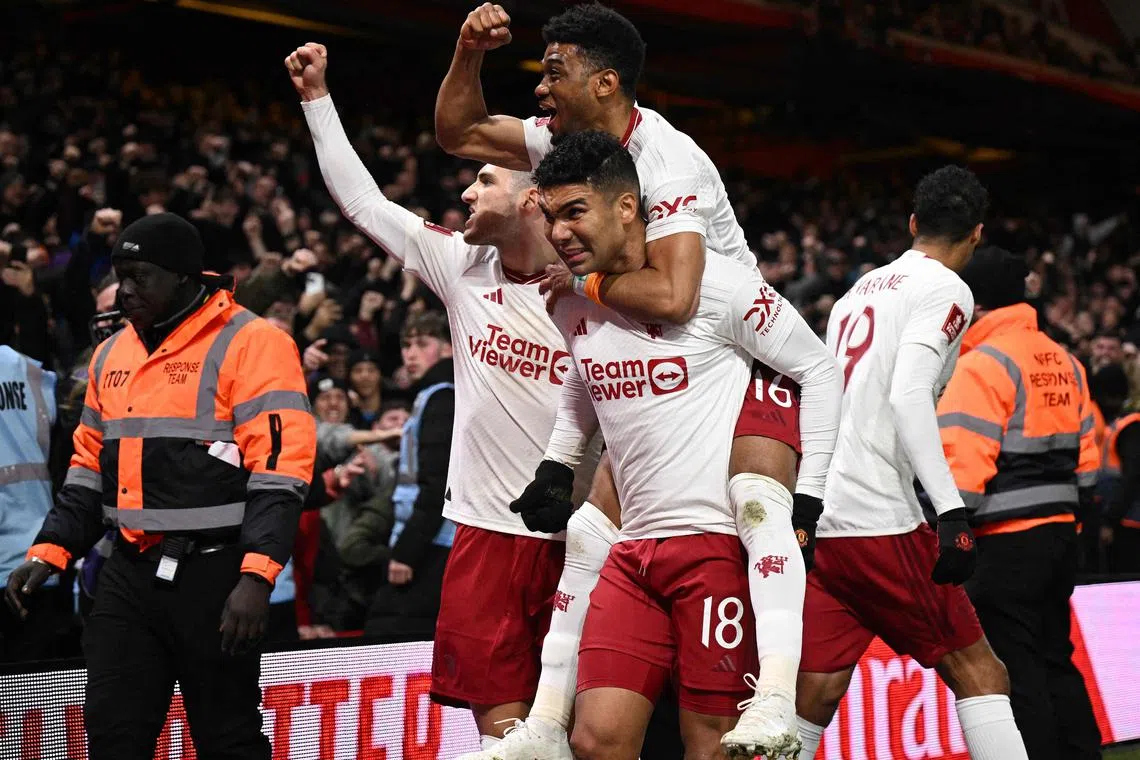 Manchester United's Brazilian midfielder #18 Casemiro celebrates scoring the opening goal during the English FA Cup fifth round football match between Nottingham Forest and Manchester United at The City Ground, in Nottingham, central England, on February 28, 2024. (Photo by Oli SCARFF / AFP) / RESTRICTED TO EDITORIAL USE. No use with unauthorized audio, video, data, fixture lists, club/league logos or 'live' services. Online in-match use limited to 120 images. An additional 40 images may be used in extra time. No video emulation. Social media in-match use limited to 120 images. An additional 40 images may be used in extra time. No use in betting publications, games or single club/league/player publications. / 