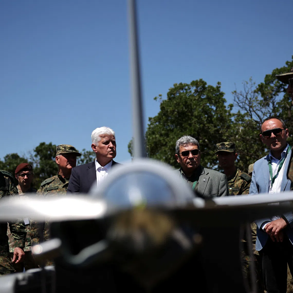Bulgarian defence minister Dimitar Stoyanov talks to soldiers near a drone during \"Strike Back 26\" military drill, involving troops and vehicles from Bulgaria, the U.S., Italy, Turkey, and Romania, in Koren, Bulgaria, June 11, 2026. REUTERS/Stoyan Nenov
