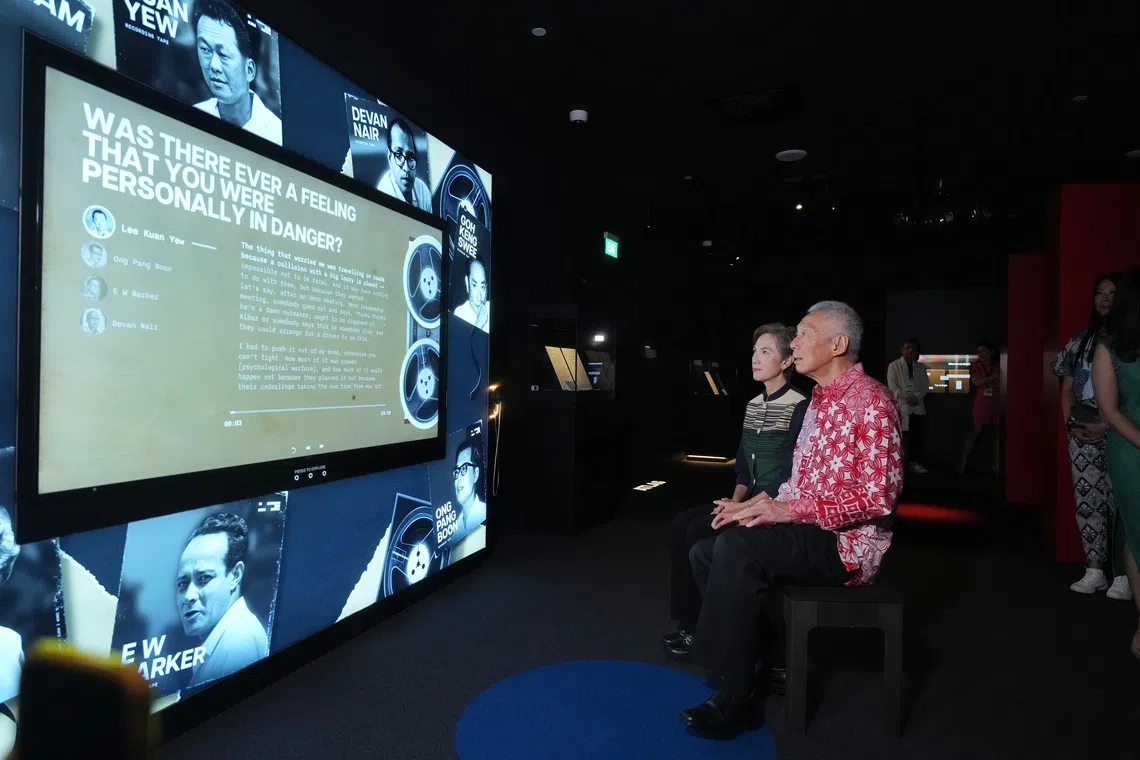 Senior Minister Lee Hsien Loong and Minister for Digital Development and Information Josephine Teo viewing an exhibit at the launch of the Albatross File book and exhibition at the National Library in Victoria Street on Dec 7. 