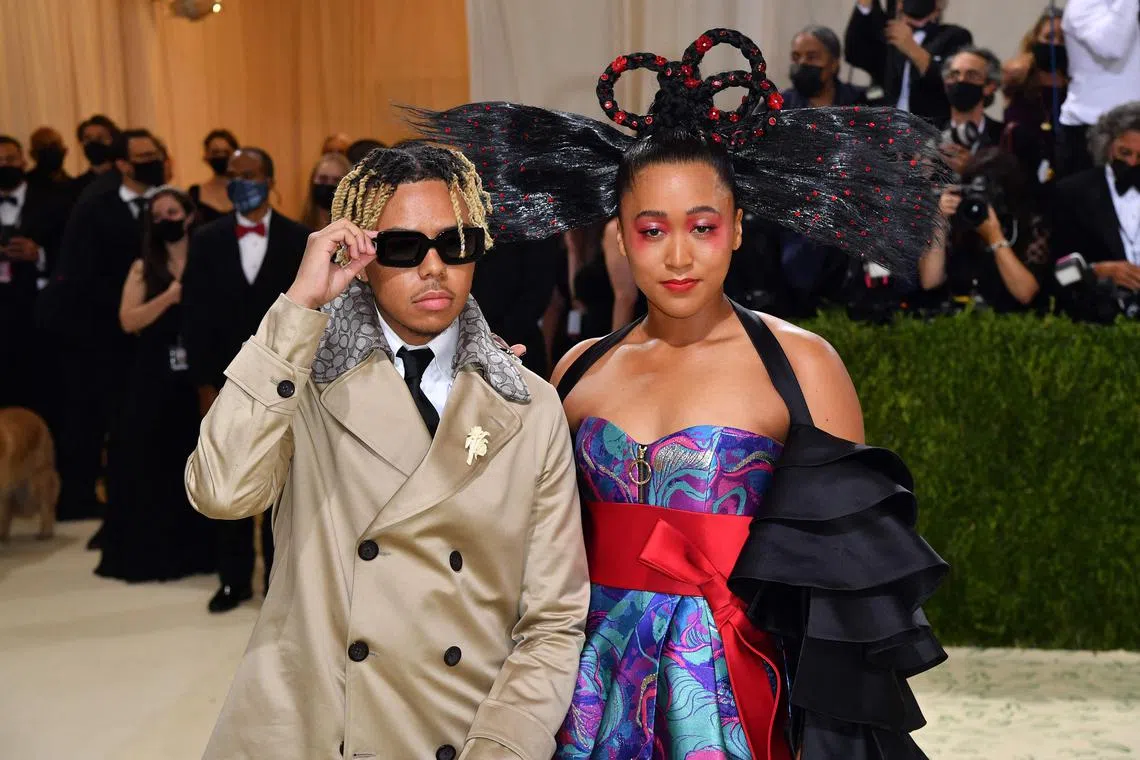 A 2021 photo shows Naomi Osaka and US singer Cordae arriing for the 2021 Met Gala.