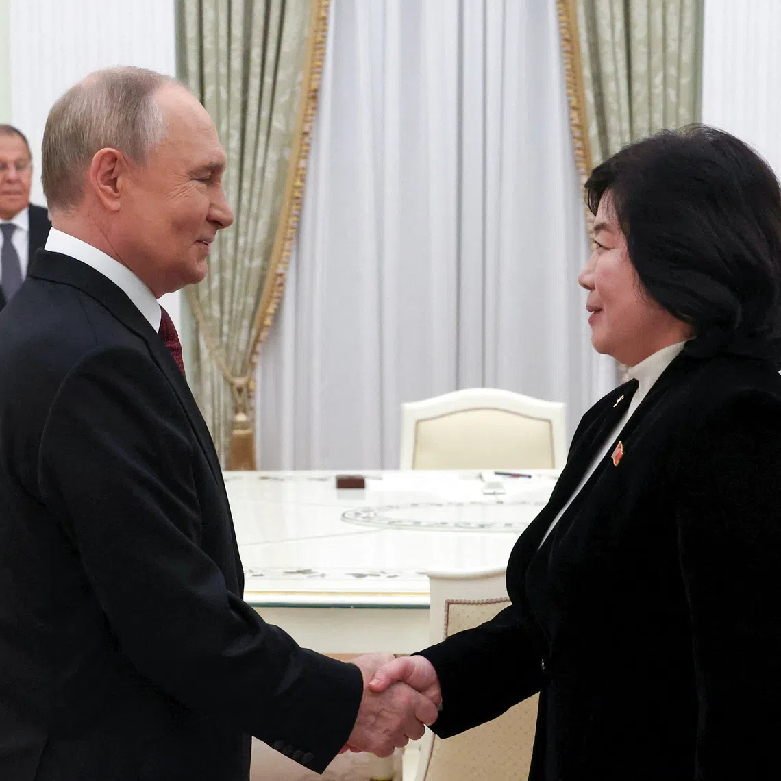 Russian President Vladimir Putin shakes hands with North Korean Foreign Minister Choe Son Hui during a meeting in Moscow, Russia, October 27, 2025. Sputnik/Vyacheslav Prokofyev/Pool via REUTERS