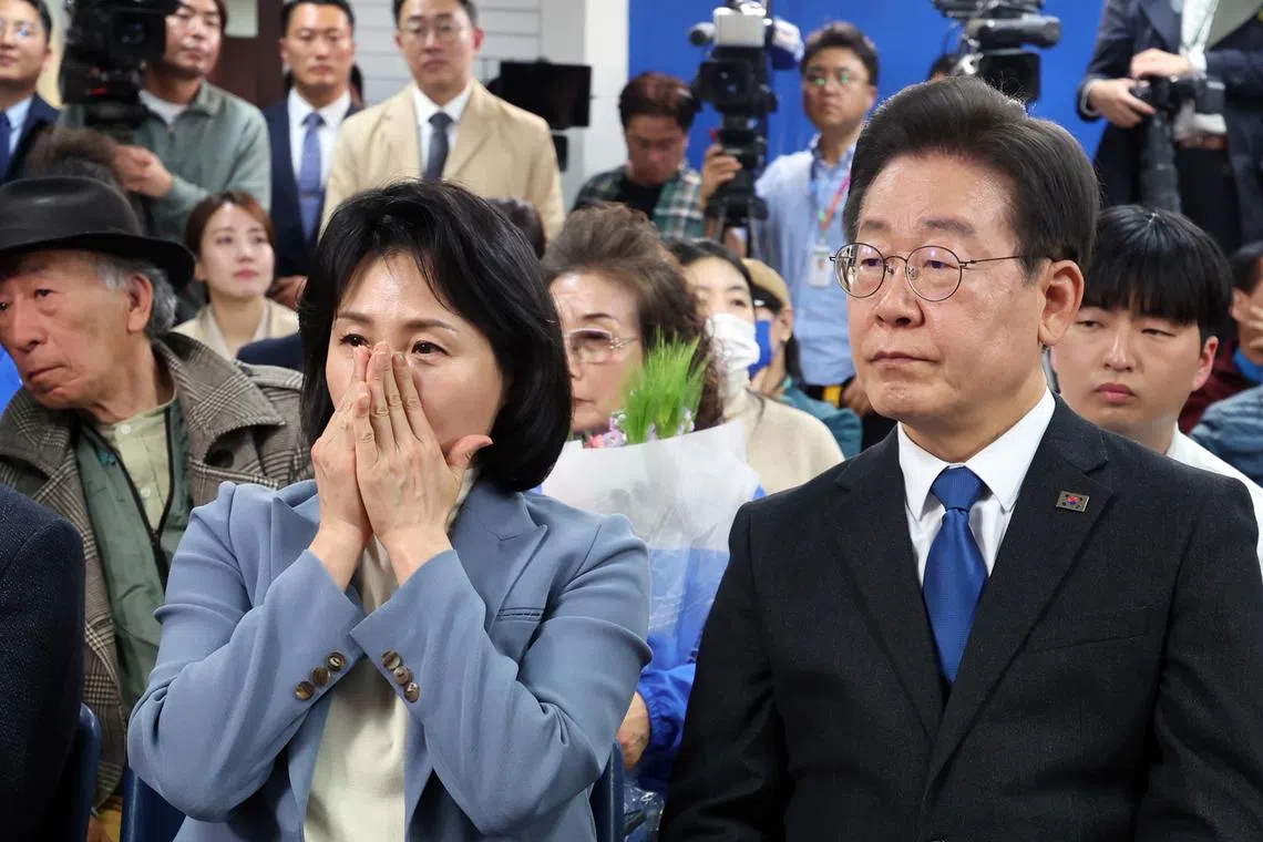 Democratic Party leader Lee Jae-myung and his wife Kim Hye-kyung at a district office in Incheon on April 11.